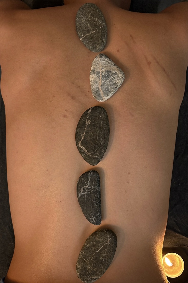 A massage in a candlelit treatment room