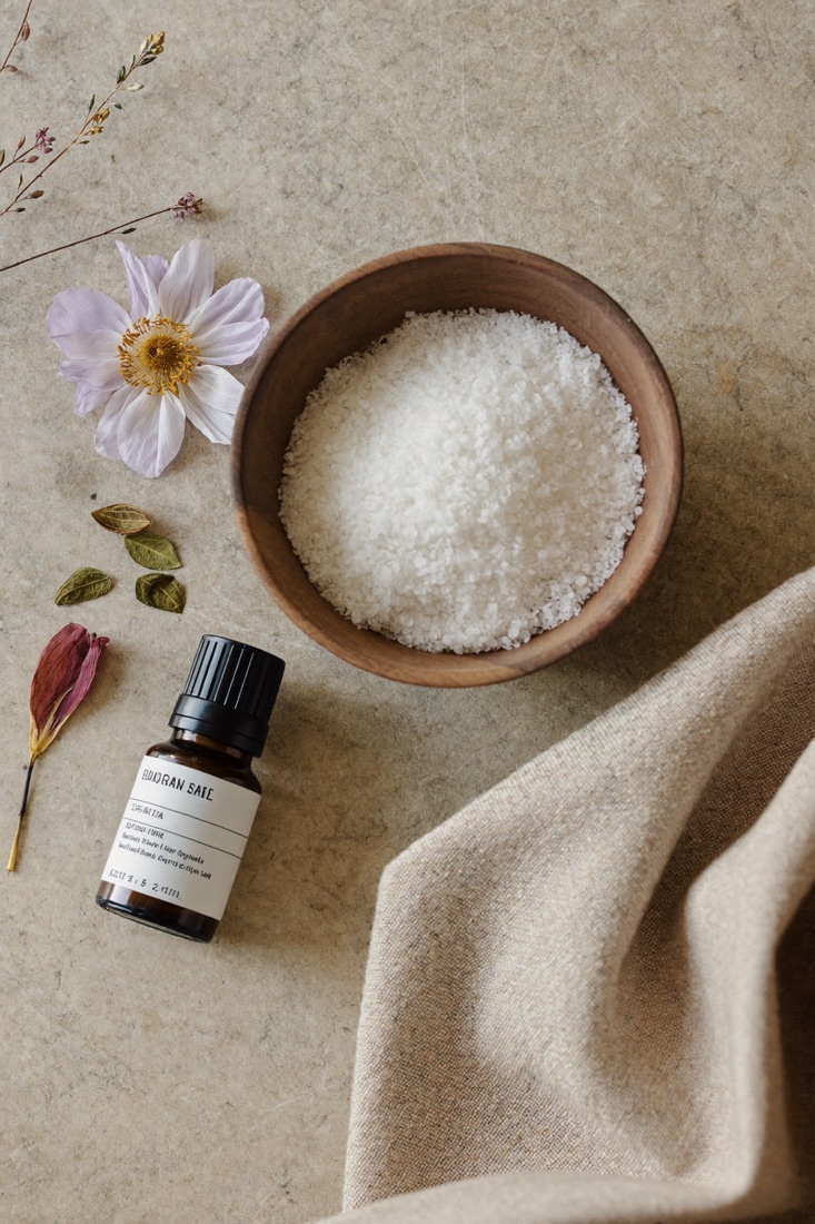 Sea salt, botanical oil and dried petals for a body scrub